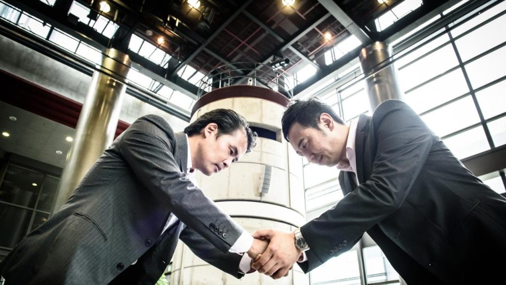 shaking hands sales in japan